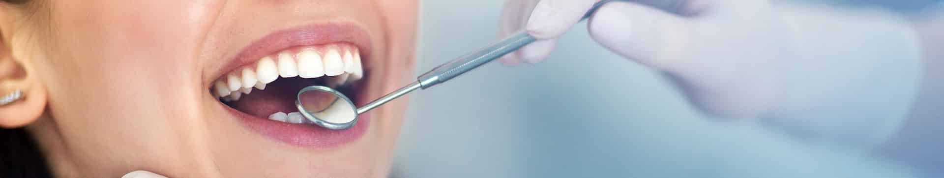 Woman having teeth examined. Oral cancer screening Marietta, GA.