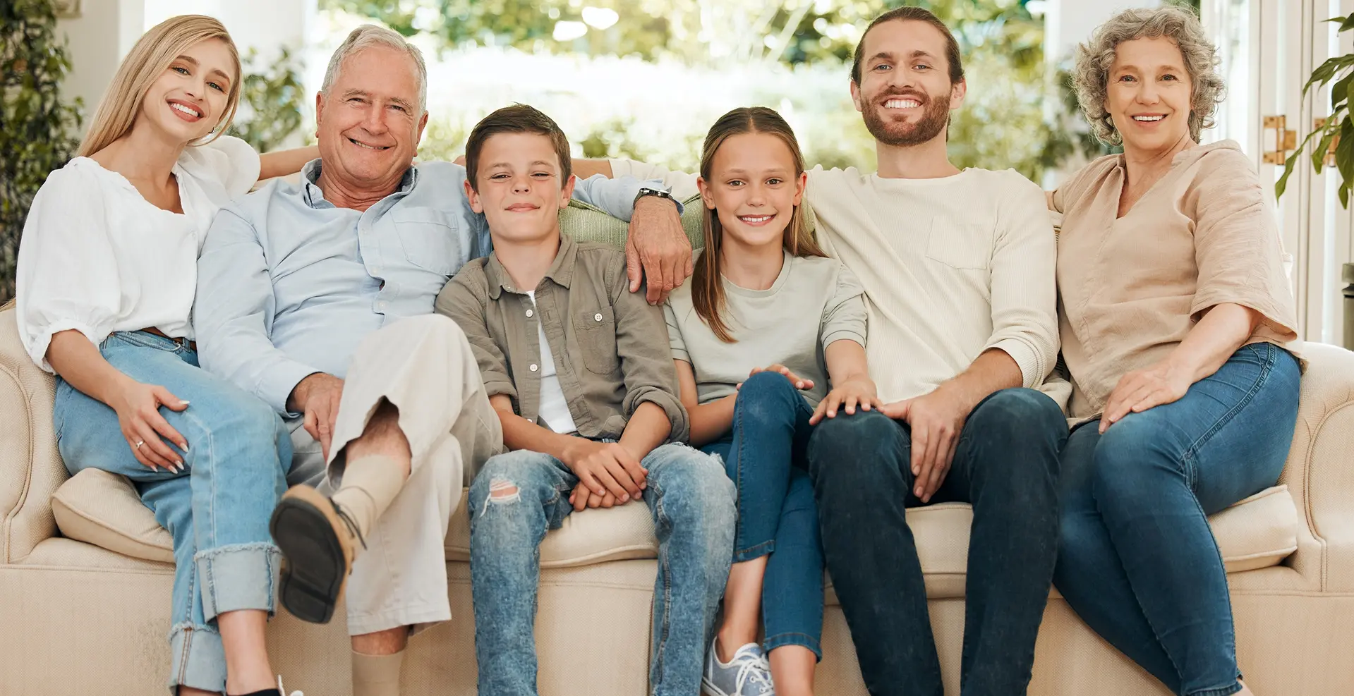 Smiling family standing together outdoors